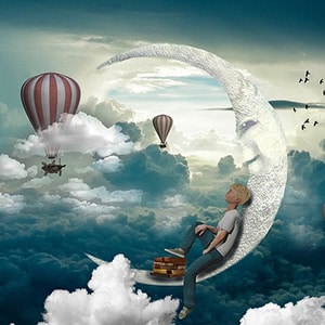 Boy sitting on the moon amongst the clouds